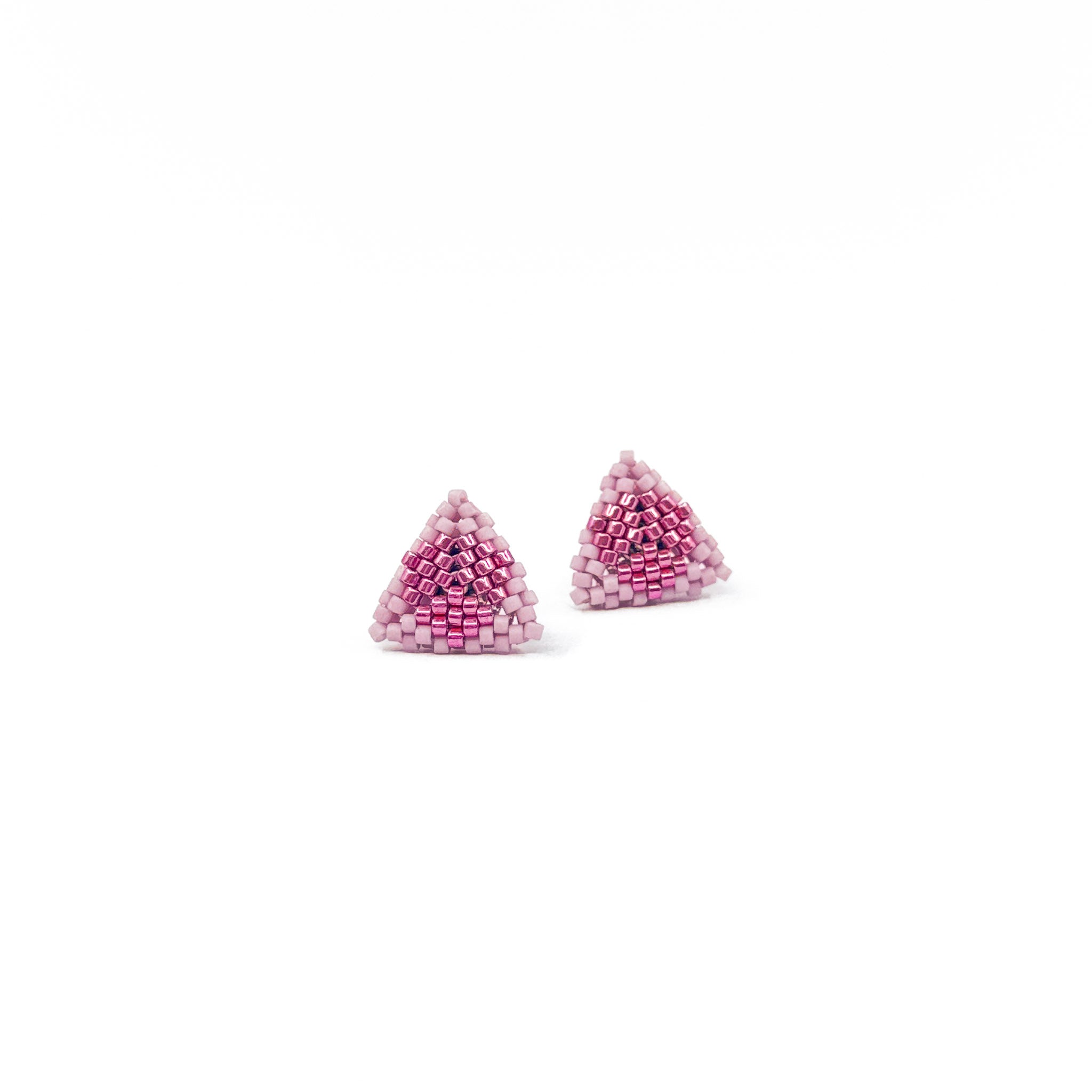 Pink beaded triangle stud earrings with metallic center detail, antique pink beads, front.