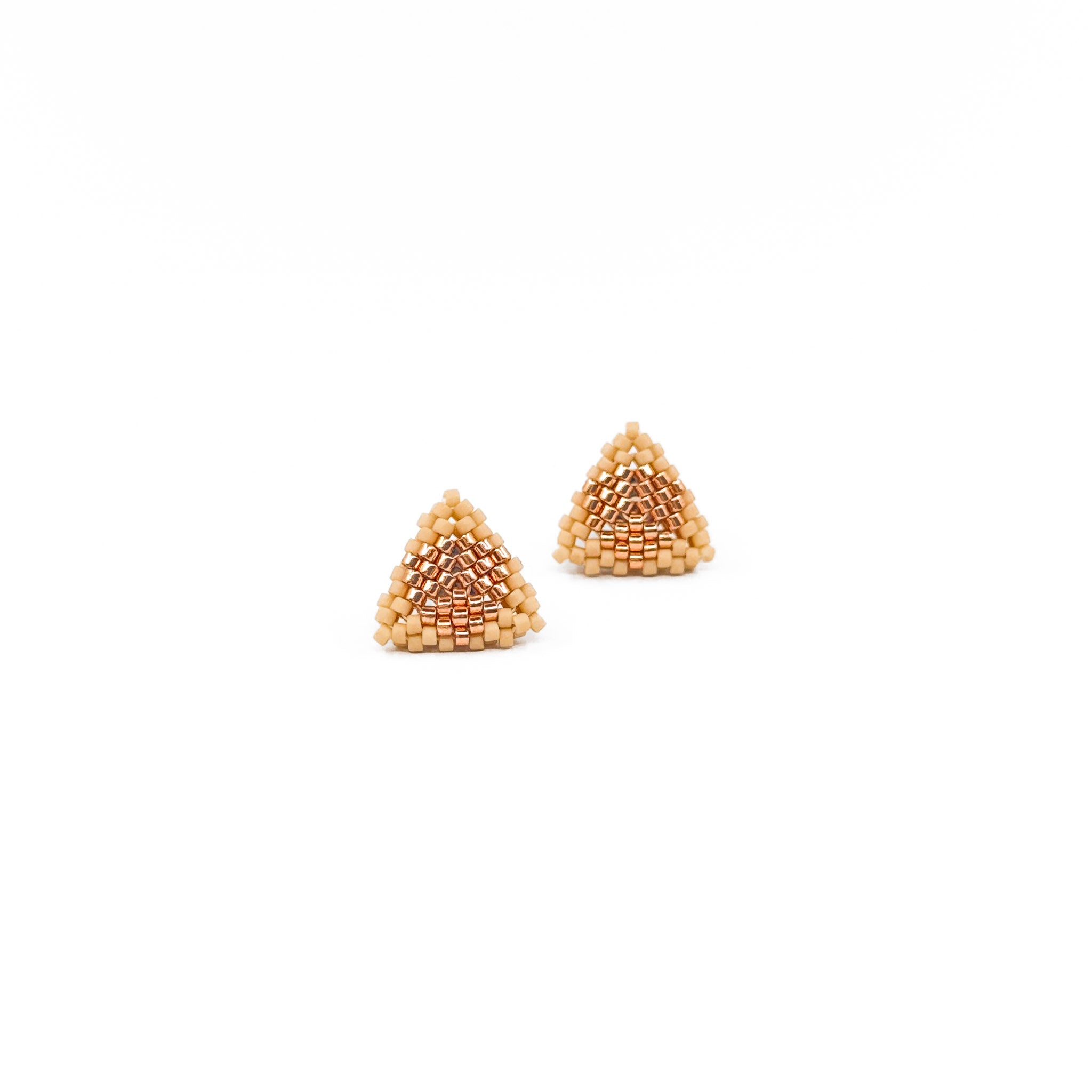 Beige beaded triangle stud earrings with metallic center detail, rosy beige beads, front view.