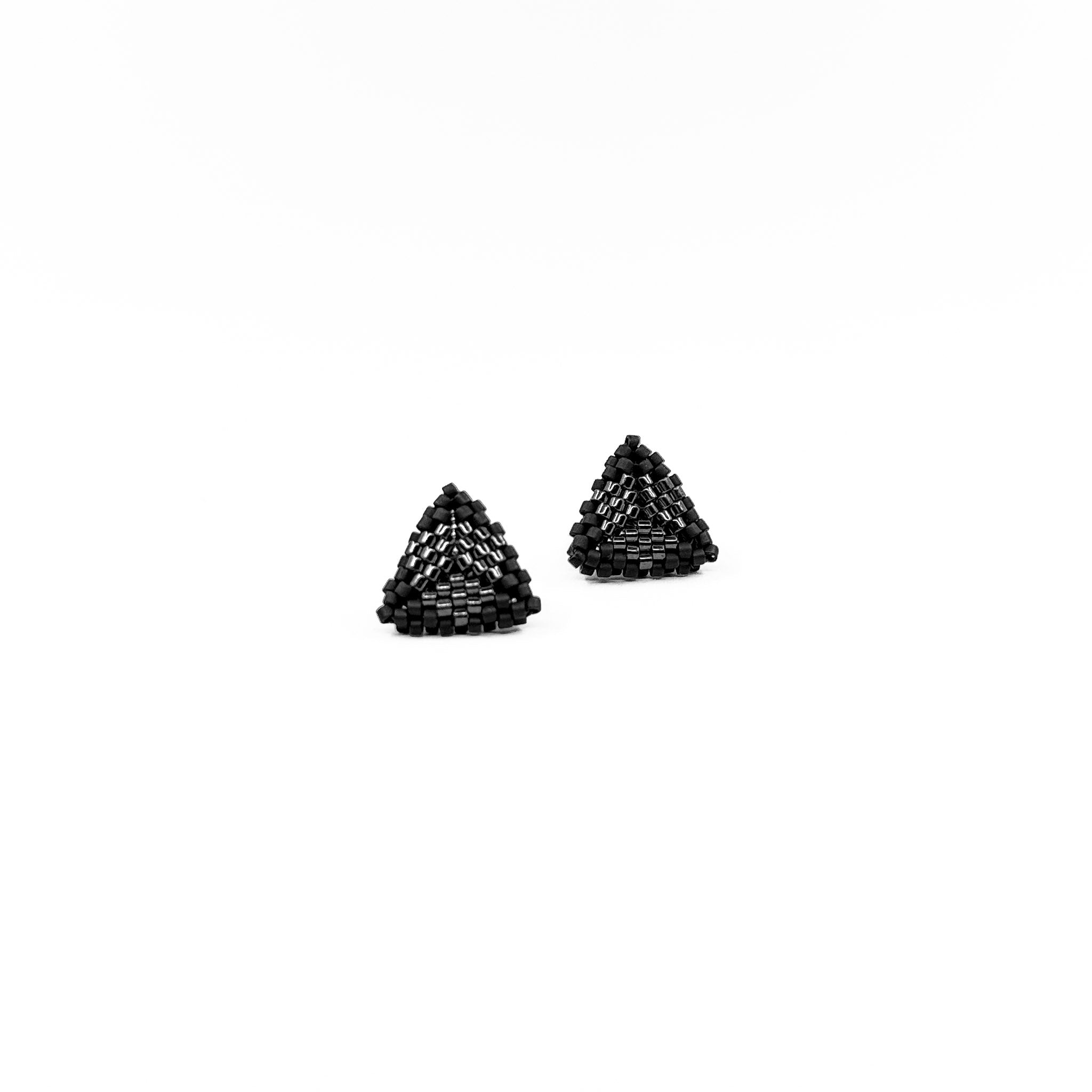 Black beaded triangle stud earrings with metallic center detail, charcoal black beads, front view.