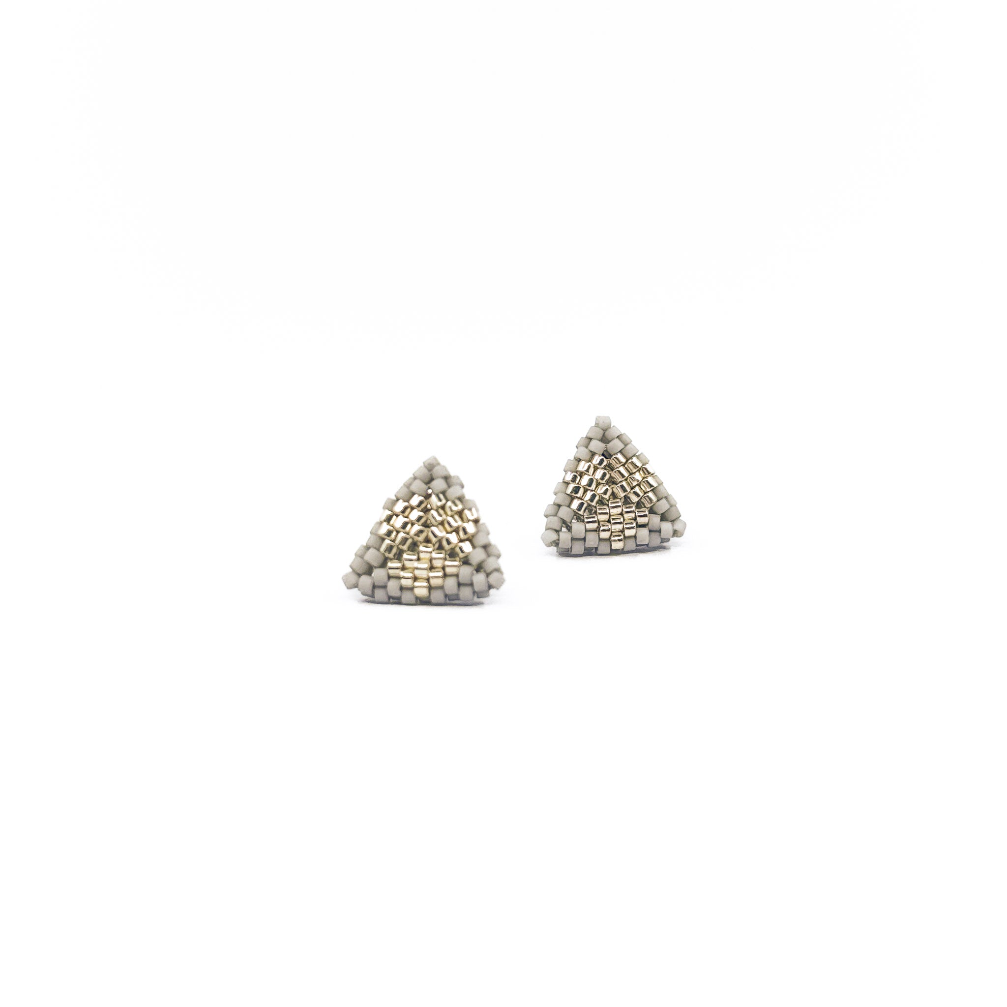 Gray beaded triangle stud earrings with metallic center detail, gray beads, front view.